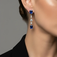 Close up of the 925 Silver Blue Duo Earrings demonstrating the detachable 2-in-1 mechanism and rhodium finish.
