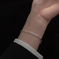 Close up of 925 silver paperclip bracelet showing precision elongated link geometry