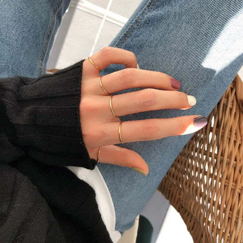 14K gold-plated essential stacking band ring in hallmarked 925 silver, ultra-slim 1mm width on white background, Loretana minimalist design.