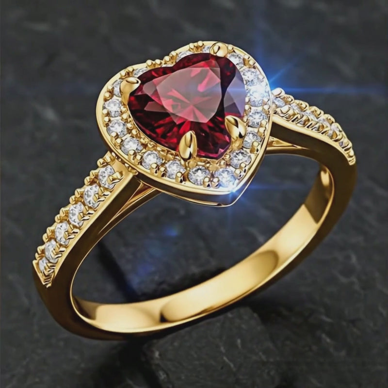 Rotating product video of the 14K gold plated 925 silver heart ring with red ruby AAAAA zirconia. Hallmarked Loretana piece, hand-finished in Kaunas.