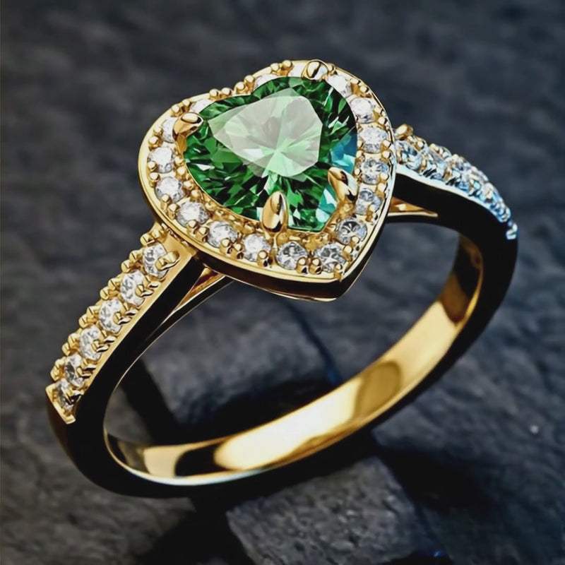 Rotating product video of the 14K gold plated 925 silver heart ring with green emerald AAAAA zirconia. Hallmarked Loretana piece, hand-finished in Kaunas.