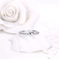 Front view of the rhodium plated 925 silver heart ring on white, showing the AAAAA heart cut zirconia solitaire. Hallmarked Loretana piece, hand-finished in Kaunas.